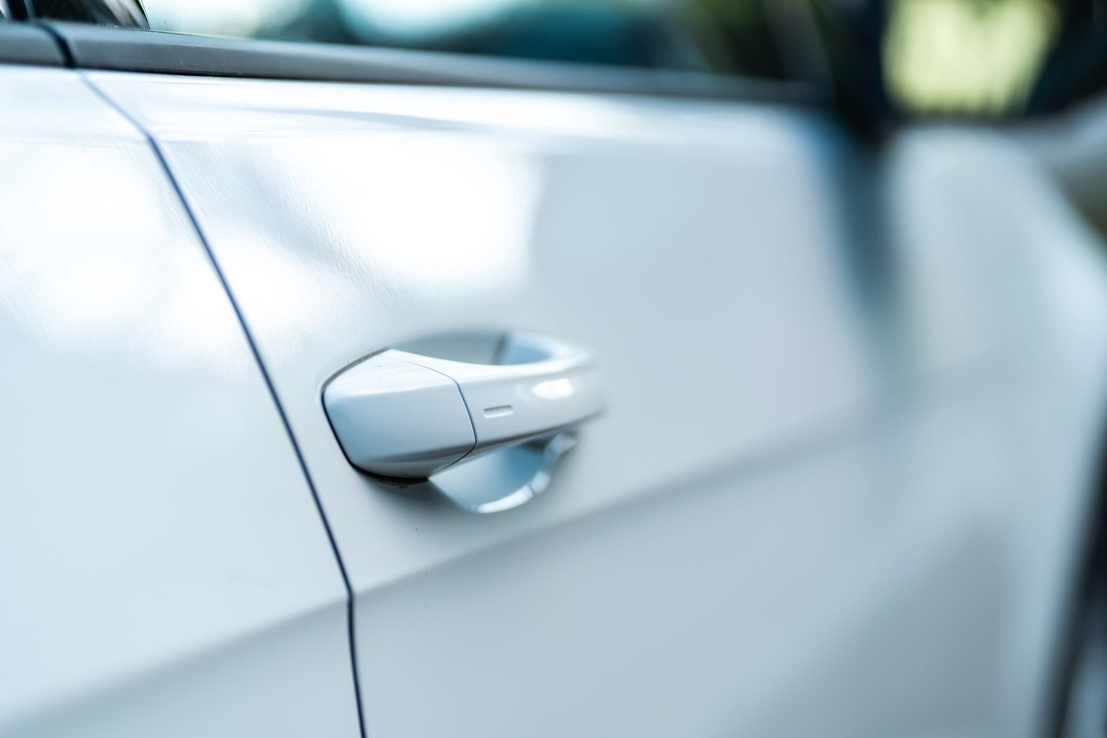 Closeup of a bright car door. Concept for a modern car